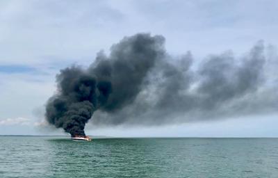 Three people are safe after being rescued from a burning boat near Gardiner's Island Friday afternoon. Three people are safe after being rescued from a burning boat near Gardiner's Island Friday afternoon.