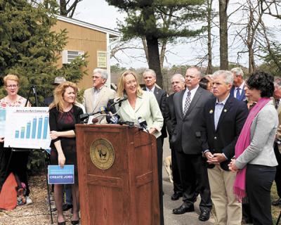 County Legislator Bridget Fleming, center, was among the officials who support County Executive Steve Bellone’s proposal for a referendum to tax water bills to create a water pollution abatement fund. County Legislator Bridget Fleming, center, was among the officials who support County Executive Steve Bellone’s proposal for a referendum to tax water bills to create a water pollution abatement fund.