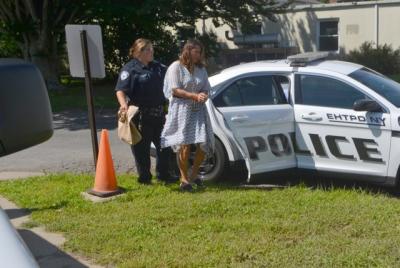 Julia Moffett was led into East Hampton Town Justice Court for her arraignment on Thursday. Her lawyers said "there is no evidence that my client has done anything wrong." Julia Moffett was led into East Hampton Town Justice Court for her arraignment on Thursday. Her lawyers said "there is no evidence that my client has done anything wrong."