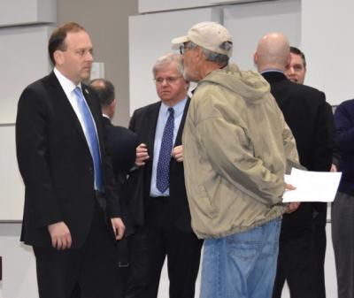 Representative Lee Zeldin and other officials mingled with constituents and colleagues before the hearing began. Assemblyman Fred W. Thiele Jr. can be seen to the right of Mr. Zeldin. Representative Lee Zeldin and other officials mingled with constituents and colleagues before the hearing began. Assemblyman Fred W. Thiele Jr. can be seen to the right of Mr. Zeldin.