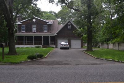 East Hampton Town police found spent shotgun shells in the street in front of this house on Oakview Highway.