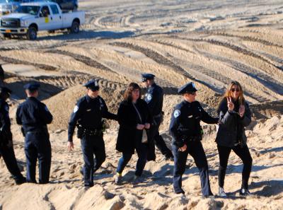 Lisa Spellman, who flashed a peace sign, and Bess Rattray, were arrested on disorderly conduct charges Monday morning. Lisa Spellman, who flashed a peace sign, and Bess Rattray, were arrested on disorderly conduct charges Monday morning.