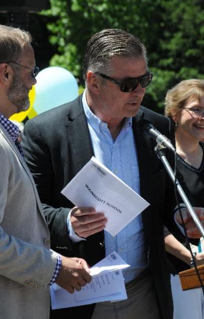 Alec Baldwin, seen here in 2014 at the opening of the new children's wing at the East Hampton Library where he helped hand out awards to school children, has given a baby grand piano to the Springs School District, but the school doesn't seem to have room for it.