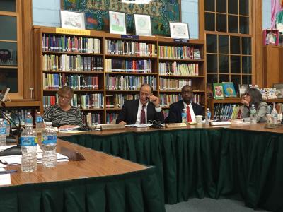John J. Finello, superintendent of the Springs School District, center, was the target of several negative comments during the public comment sessions at Monday's school board meeting.