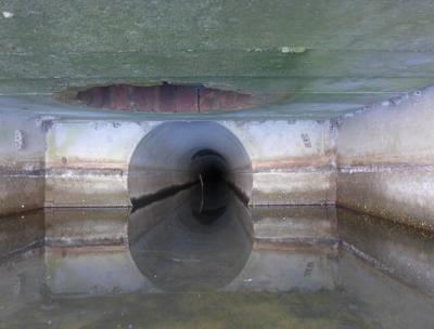 The Cove Hollow end of a roughly mile-and-a-half concrete drain pipe that reaches to the fields off Route 114 in East Hampton The Cove Hollow end of a roughly mile-and-a-half concrete drain pipe that reaches to the fields off Route 114 in East Hampton