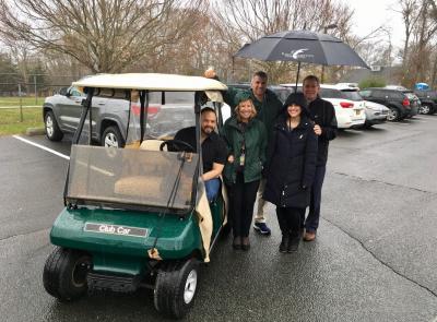 Eric Casale, the Springs School principal, was behind the wheel of a golf cart newly donated by the East Hampton Golf Club for use in emergencies. Next to him, from left, were Debra Winter, the district superintendent, Chris Varga, a school security officer, Laura Foty, an administrative assistant, and Tom Barnard, the club's general manager.