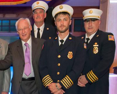 Elbert T. Edwards, far left, at an East Hampton Fire Department dinner in April, died last Thursday. Elbert T. Edwards, far left, at an East Hampton Fire Department dinner in April, died last Thursday.