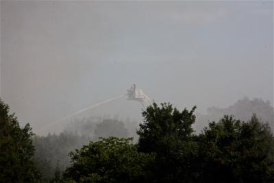 From a bucket on a ladder truck, firefighters doused the flames shooting from a house on Wyandanch Lane in Southampton. From a bucket on a ladder truck, firefighters doused the flames shooting from a house on Wyandanch Lane in Southampton.
