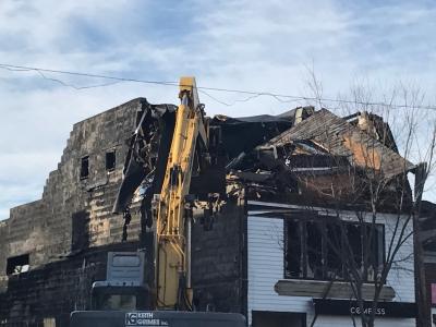 Keith Grimes Inc. worked to demolish the building at 84 Main Street in Sag Harbor, three days after a fire gutted it and undermined its structural integrity. Keith Grimes Inc. worked to demolish the building at 84 Main Street in Sag Harbor, three days after a fire gutted it and undermined its structural integrity.