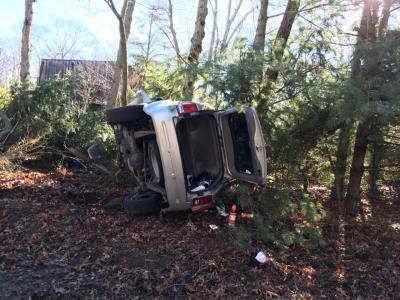 A Jeep Grand Cherokee rolled over onto its side after crashing into the woods on Wednesday morning. A Jeep Grand Cherokee rolled over onto its side after crashing into the woods on Wednesday morning.
