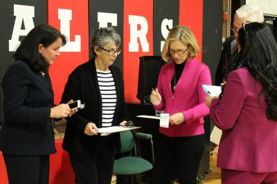 From left, Katy Graves, the Sag Harbor superintendent, along with Judy Lattanzio, the chief officer of elections for the turf field vote, Mary Adamczyk, the district clerk, Ronald Ryan, a Suffolk County Board of Elections technician, and Jennifer Buscemi, the school business administrator, tallied the results of the vote on Wednesday night.