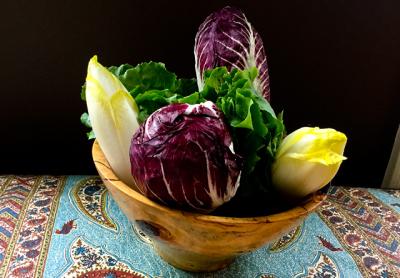 A mélange of bitter greens — in this case, escarole, radicchio, and endive — can be used raw or cooked to create different flavor profiles. A mélange of bitter greens — in this case, escarole, radicchio, and endive — can be used raw or cooked to create different flavor profiles.