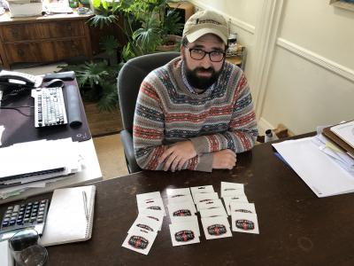 Joshua Borsack, at his desk at Strong Insurance Agency in East Hampton, showed just a fraction of the gift cards he and his wife, Summer Borsack, have collected for Coast Guard members stationed in Montauk.