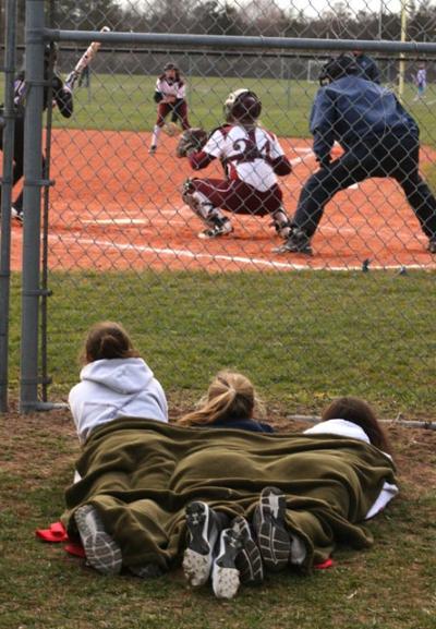 Neither the weather nor the score was pleasing insofar as East Hampton’s softball fans were concerned Monday, though they made the best of it.