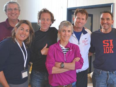 Mary Ellen Adipietro, left, and her husband, Frank Adipietro, at right, posed before last year’s Shelter Island 10K, which she directs, with Cliff Clark, one of the race’s founders, and Bill Rodgers, Joan Benoit Samuelson, and John Sinclair, three American marathon greats. Mary Ellen Adipietro, left, and her husband, Frank Adipietro, at right, posed before last year’s Shelter Island 10K, which she directs, with Cliff Clark, one of the race’s founders, and Bill Rodgers, Joan Benoit Samuelson, and John Sinclair, three American marathon greats.