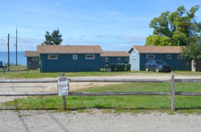All four of the small cottages overlooking Fort Pond Bay are to be knocked down to make way for three larger resort units built of steel, glass, and mahogany. All four of the small cottages overlooking Fort Pond Bay are to be knocked down to make way for three larger resort units built of steel, glass, and mahogany.