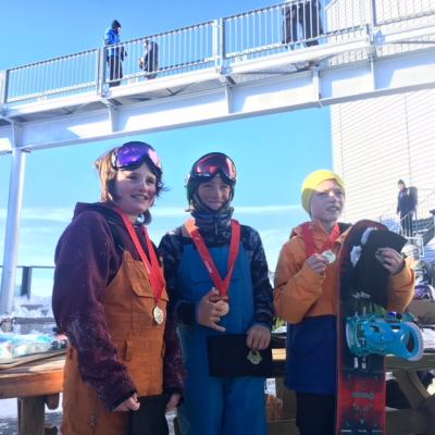 Noah Avallone, middle, after winning a Glacier 3000 slopestyle race in Switzerland in November.
