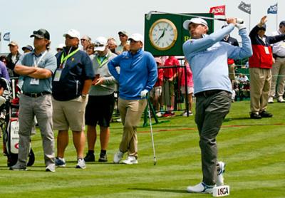 Kevin Kisner, for whom Duane Bock, second from left, caddies, teed off at Shinnecock’s first hole with the 12:41 group Monday. Kevin Kisner, for whom Duane Bock, second from left, caddies, teed off at Shinnecock’s first hole with the 12:41 group Monday.