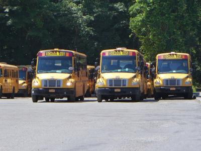 Buses lined up at the East Hampton School District's depot on Route 114, which the district leases. Buses lined up at the East Hampton School District's depot on Route 114, which the district leases.