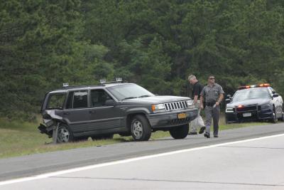 An East Hampton couple were hit by a car as they stood on the side of Sunrise Highway, observing a brush fire, on Saturday morning. An East Hampton couple were hit by a car as they stood on the side of Sunrise Highway, observing a brush fire, on Saturday morning.