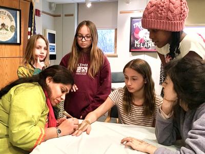 Eakta Gandhi, a henna artist based in Riverhead, visited the Montauk Library last week, where over 30 girls lined up to have their hands painted with mehndi, an Indian tradition that dates back several thousand years, and one that Ms. Gandhi learned as a girl in India. Eakta Gandhi, a henna artist based in Riverhead, visited the Montauk Library last week, where over 30 girls lined up to have their hands painted with mehndi, an Indian tradition that dates back several thousand years, and one that Ms. Gandhi learned as a girl in India.