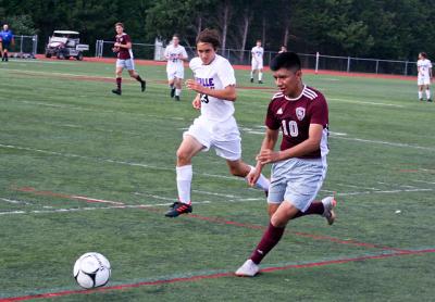 A perfect waist-high cross into the penalty box by Keith Quihuiri (10) in the first period of East Hampton’s 2-1 loss here to Sayville on Sept. 5 unaccountably went for naught.