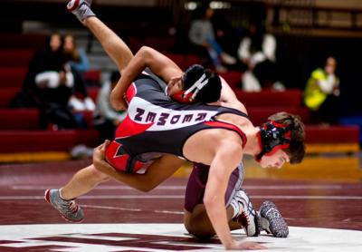 Caleb Peralta (on top), who placed third in the 126-pound division at a recent invitational tournament in Half Hollow Hills, pinned his East Islip opponent with 10 seconds to go in the first period here Friday.