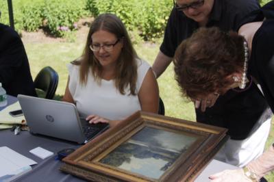 Shani Toledano, the associate director of Doyle Auctioneers and Appraisal's paintings department, took a good two or three minutes before raising her head and announcing her verdict.