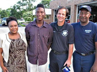 Jerome Walker Jr. weighed just 1 pound 9 ounces and was not breathing when he was born on July 4, 1996, three months premature. At his high school graduation last month, he met the volunteer first responder who helped deliver him, Philip Cammann, for the first time. His parents, Penny Walker, left, and Jerome Walker Sr., right, credit Mr. Cammann with saving his life.  	Walker Family,