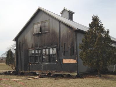 Firefighters put out a grass fire on Wednesday at the Hayground School in Bridgehampton that had reached a kitchen building and was climbing an outside wall. Firefighters put out a grass fire on Wednesday at the Hayground School in Bridgehampton that had reached a kitchen building and was climbing an outside wall.