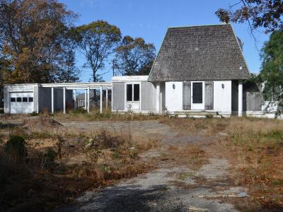 A dilapidated house on a Springs half-acre would be replaced with a newer, larger one in the same location, which has East Hampton Town planners concerned about its impact on a nearby pond. A dilapidated house on a Springs half-acre would be replaced with a newer, larger one in the same location, which has East Hampton Town planners concerned about its impact on a nearby pond.
