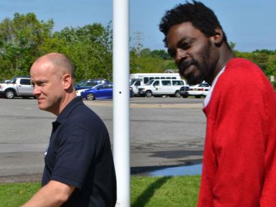 Quamine T. Taylor, right, outside East Hampton Town Justice Court on Saturday after an appearance on a 2013 arrest warrant resulted in his arrest in Westhampton.