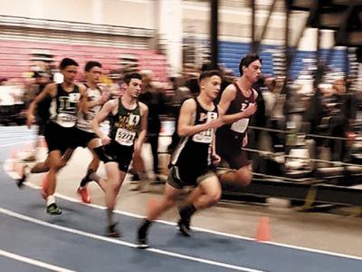 Ryan Fowkes, above at right and below center, racing to a second-place finish in the 1,000 meters at the state qualifier meet at Suffolk Community College-Brentwood last week. Ryan Fowkes, above at right and below center, racing to a second-place finish in the 1,000 meters at the state qualifier meet at Suffolk Community College-Brentwood last week.