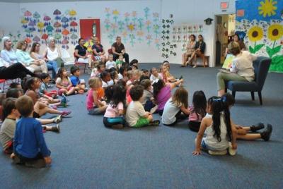 Students at the Eleanor Whitmore Early Childhood Center listened as East Hampton Town Councilwoman Kathee Burke-Gonzalez read last week from one of her favorite children's books as part of a series of guest-reader events. The center has entered into another one-year contract to provide a full-day prekindergarten program for the East Hampton School District.