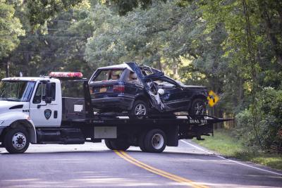 The Land Rover that crashed into the woods in Springs on Wednesday morning was taken away by a tow truck and impounded. The Land Rover that crashed into the woods in Springs on Wednesday morning was taken away by a tow truck and impounded.