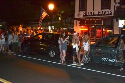 Crowds flooded into the street in downtown Montauk on Tuesday to watch the Fourth of July fireworks there. The four-day holiday weekend kept East Hampton Town police, fire marshals, and ordinance enforcement and marine patrol officers busy. Crowds flooded into the street in downtown Montauk on Tuesday to watch the Fourth of July fireworks there. The four-day holiday weekend kept East Hampton Town police, fire marshals, and ordinance enforcement and marine patrol officers busy.