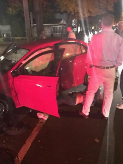 The driver of a Volkswagen Jetta that slammed into parked cars in Bridgehampton lay on the ground on Main Street Wednesday night. The driver of a Volkswagen Jetta that slammed into parked cars in Bridgehampton lay on the ground on Main Street Wednesday night.