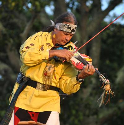 Arvel Bird playing violin at the Shinnecock Powwow Arvel Bird playing violin at the Shinnecock Powwow
