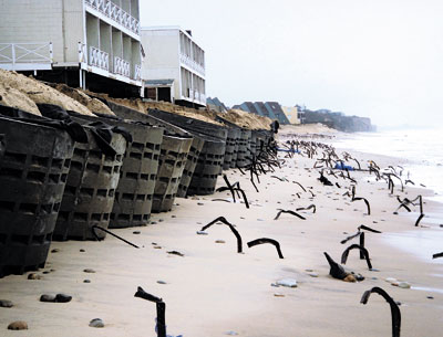 Concrete “rings” placed in front of the Royal Atlantic Resort after Hurricane Sandy and a subsequent storm and long-buried metal fence stakes were exposed by last week’s destructive northeaster. Concrete “rings” placed in front of the Royal Atlantic Resort after Hurricane Sandy and a subsequent storm and long-buried metal fence stakes were exposed by last week’s destructive northeaster.