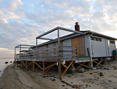 The East Hampton Town Trustees have sued the town zoning board of appeals over its decision to allow a sea wall to be built in front of a house owned by Christiane Lemieux and Joshua Young at Lazy Point, Amagansett.