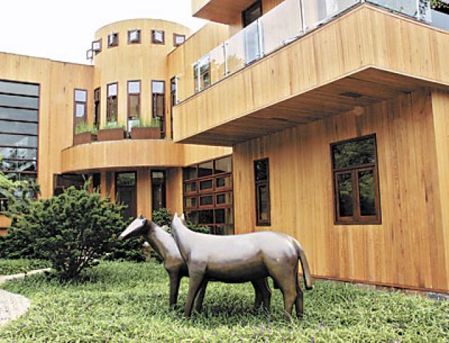 A sculpture of horses by Robert L. Hooke, an artist who lives in Sag Harbor, welcomes visitors to Susan Goldstein’s North Haven house. Her  daughter is a professional equestrian.