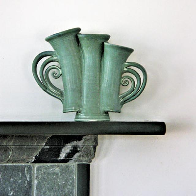 Audacious curves and shapes characterize many of the ceramic pieces.
