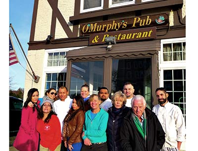 O’Murphy’s Pub closed for good on Saturday after its owners, Jan and Chester Kordasz, front right, decided that they could not afford a pending rent increase. O’Murphy’s Pub closed for good on Saturday after its owners, Jan and Chester Kordasz, front right, decided that they could not afford a pending rent increase.