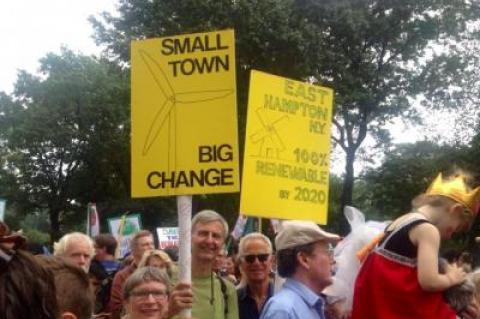 Gordian Raacke, center, of Renewable Energy Long Island, held a sign touting East Hampton Town's commitment to getting all its energy from renewable sources by 2020. Gordian Raacke, center, of Renewable Energy Long Island, held a sign touting East Hampton Town's commitment to getting all its energy from renewable sources by 2020.