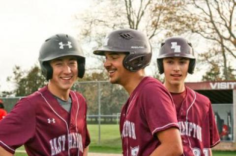 East Hampton High’s baseball players, above, had the last laugh in the season’s final series last week, winning three in a row from Amityville; E. Bistrian, hounded below by a Sayville defender, and her very young girls lacrosse teammates went 2-12 this spring.