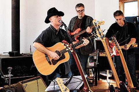 Mick Hargreaves practiced in his studio with members of his band, the King Guys, last weekend.