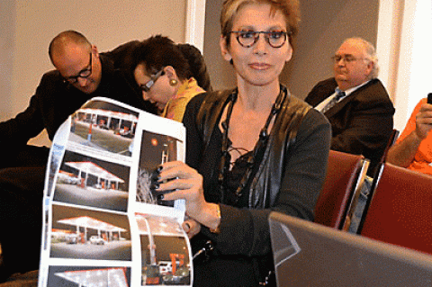 Vered showed photographs of a service-station canopy proposed for elsewhere in the village that she felt was far more distasteful than the “Legs” sculpture, below, that she and her partner, Janet Lehr, must take down.