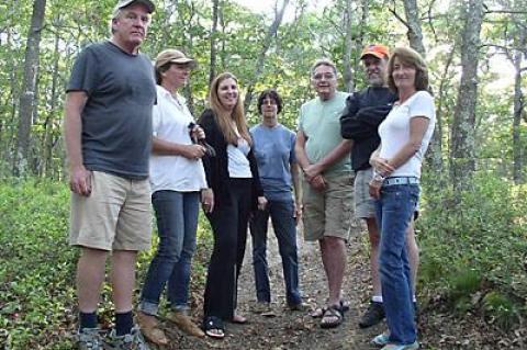 Neighbors, from left, John and Regina Whitney, Nanci LaGarenne, Paula Weidmann, Dan Weidmann, Steve Cohen, and Dana Kalbacher, hope to prevent the development on Oakview Highway.
