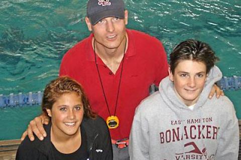 Tom Cohill, shown with Georgie Bogetti and Trevor Mott, was impressed by their long-distance performances at Lehman College this past weekend.
