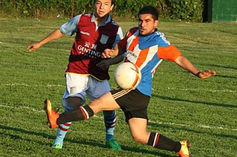 Marco Bautista, at right, one of the Hideaway’s stalwarts, contended for the ball with one of the Maidstone Market’s defenders, Antonio Padilla, in the second half of a game on June 12 that the Hideaway won 3-1.